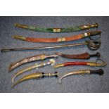 Nine various 20th century Indian and Middle-Eastern swords and daggers