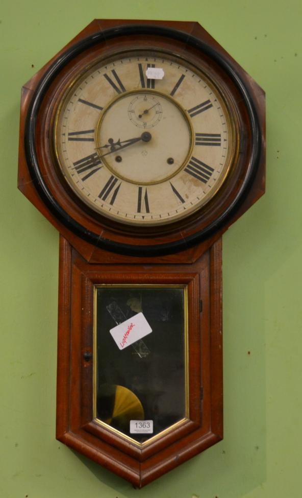 A drop dial striking wall clock