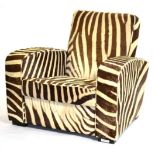 A 20th Century Armchair, upholstered in zebra skin, with padded back support and seat, with square