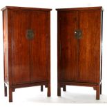 A Pair of Reproduction Chinese Elm Cabinets, each fitted with cupboard doors enclosing shelves and