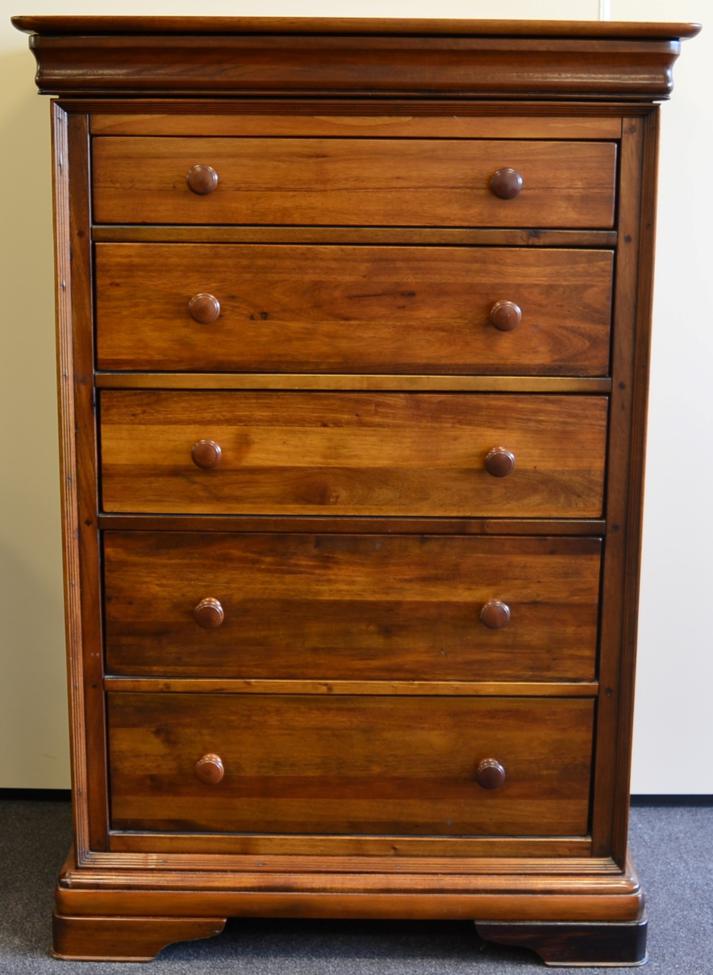 An Havanna Hardwood Chest of Drawers, retailed by Barker & Stonehouse, circa 2007, with a cushion