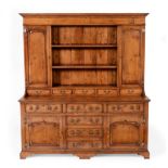 A Reproduction Oak Dresser and Rack, in George III style, the upper section with two shelves and