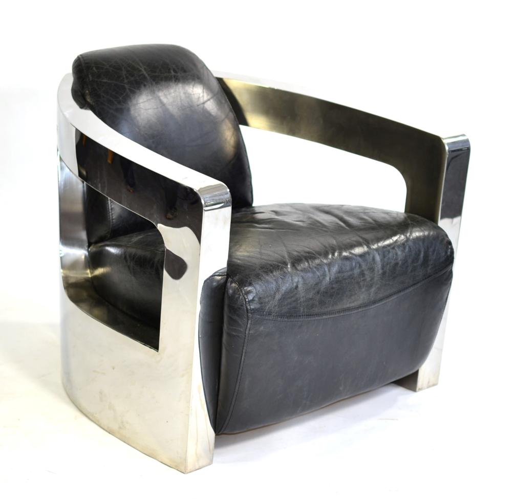 A Chromed and Black Leather Mars Style Armchair, circa 2008, with curved frame, padded back