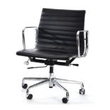 A Chrome Swivel Office Chair, of recent date, upholstered in faux black leather, with adjustable