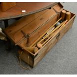 A wooden cased croquet set