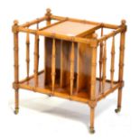 A Reproduction Faux Bamboo Canterbury, of recent date, with a spindle turned frame and two central