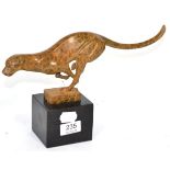 A modern patinated bronze cheetah, in a running pose, on a black marble base, 33cm wide, 19cm high