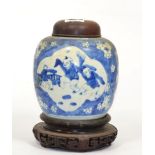 A Chinese porcelain cracked ice ginger jar, decorated with children playing, with a later wooden