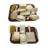 A group of assorted silver dressing table brushes and mirrors, various designs including Art Deco