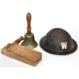 A World War II warden's helmet; gas rattle; and 'All Clear' bell, marked A.R.P