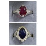 A synthetic sapphire ring, a marquise cut synthetic sapphire in a rubbed over setting, to a