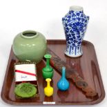 A small group of 20th century Oriental items comprising five vases, carved wooden page turner and