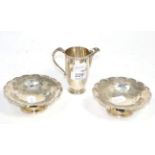 A pair of silver bonbon dishes, Mappin & Webb, Sheffield 1931, with scale decoration; and a silver