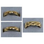 A 9 carat gold celtic scroll band ring, finger size V; a 9 carat gold crossover band ring, finger