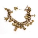 A curb link charm bracelet, with a 9 carat gold padlock clasp and seventeen 9 carat gold and other