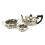 An Art Nouveau silver three piece tea service, Henry Charles Freeman, Birmingham 1899/1904, the