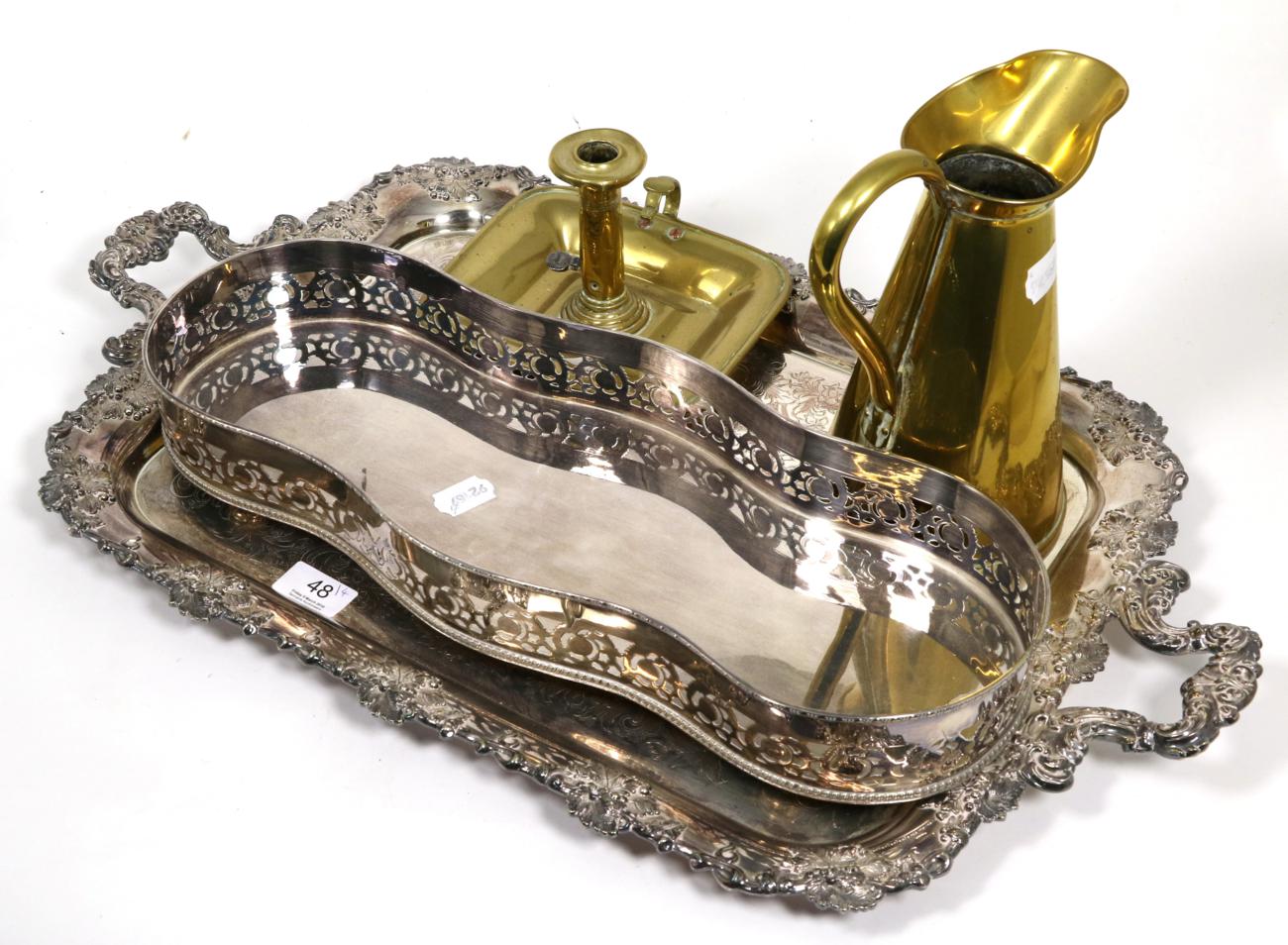 A silver plated twin handled tray with leaf decorated borders, a Georgian chamber stick, copper