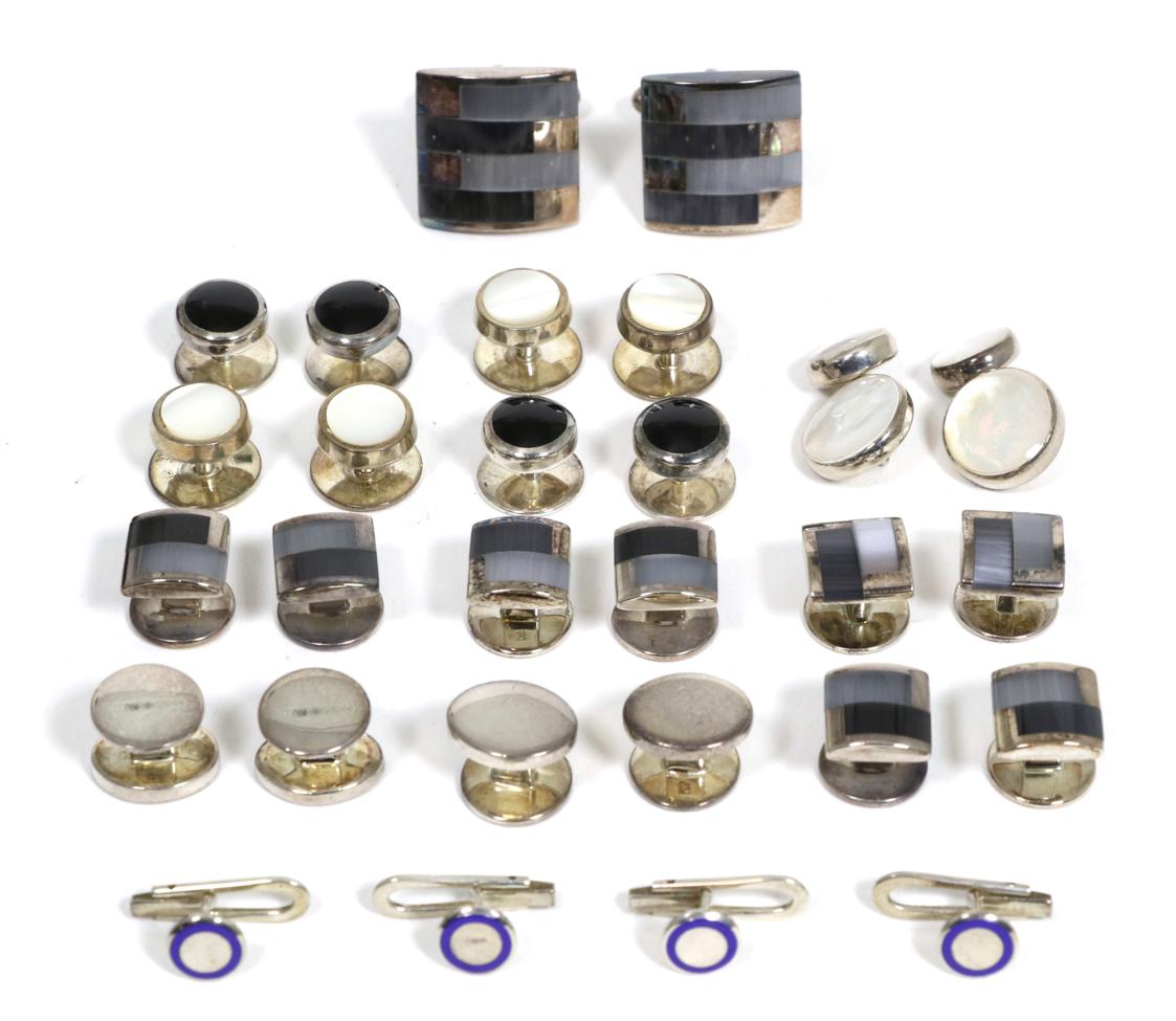 A silver and cats eye dress set, comprising a pair of swivel bar cufflinks and four dress studs,