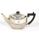 A silver teapot, William Hutton, Sheffield 1915, 25.5cm long, 16ozt