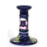 A Moorcroft pansy pattern candlestick