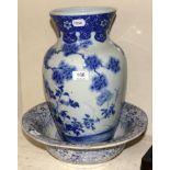 A 19th century blue and white vase, handpainted with group of storks in foliate landscape,