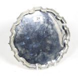 A shaped circular silver salver, Stower & Wragg, Sheffield 1941, on three scroll supports, 25.5cm