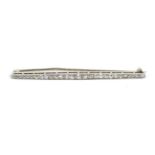 A diamond bar brooch, a tapered bar set with graduated old cut diamonds in milgrain settings,