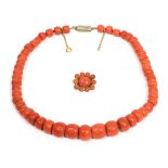 A coral bead necklace, graduated barrel-shaped coral beads knotted to a barrel clasp, length 40cm