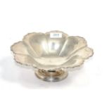 A silver pedestal bowl, Z Barraclough & Sons, Sheffield 1910, of flower shape on circular foot, 25.