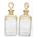 A pair of Daum cut glass decanters, with gilt decoration, gilt edged stoppers, signed Daum Cross