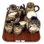 An early 20th century Japanese satsuma tea service together with a pair of matching vases and a