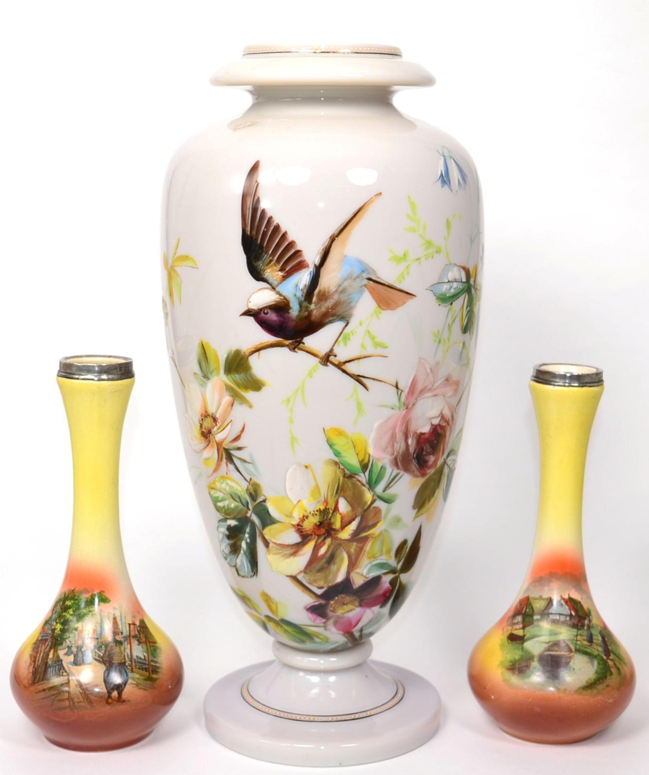 A Continental opaque glass vase painted with a garden bird perched on a branch amongst flowers;