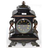 A late 19th century metal mounted black slate mantel clock, the dial signed 'Vaughan, Newport'
