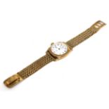 A 9 carat gold cushion shaped wristwatch signed Waltham, USA, with attached 9 carat gold bracelet
