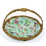 An 19th century, Chinese export enamel painted celadon dish with ormolu swing handle and mount