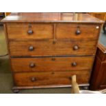 A Victorian mahogany chest of drawers comprising three long drawers and two shorter drawers above