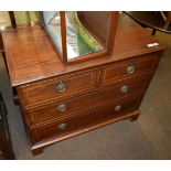 A mahogany chest of drawers with two long drawers and two short drawers