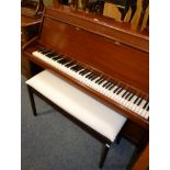A Bentley upright piano with piano stool