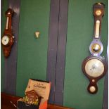 A rosewood wheel barometer, a modern cuckoo wall clock and an oak cased aneroid barometer (3)
