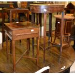 A pair of Georgian style candle stands, another small candle stand, an oval shaped sewing table