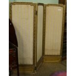 An early 20th century French gilt wood folding screen with leaf decorated pierced borders