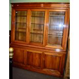 A light mahogany glazed bookcase the base with three doors