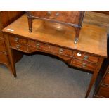 A 19th century mahogany side table containing a central long drawer and four side drawers