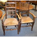 A Victorian walnut breakfast table and two Lancashire spindle back chairs (3)