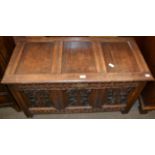 An 18th century style carved oak coffer