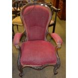 A Victorian mahogany carved armchair