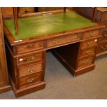 A mahogany pedestal desk