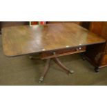 An early 19th century mahogany drop leaf table with a central single drawer, raised upon castor