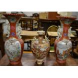 A pair of Japanese baluster vases, Meiji period, each with twin dragon handles, everted rims, hand