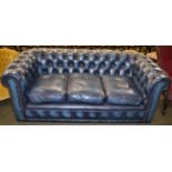 A three seater leather Chesterfield sofa